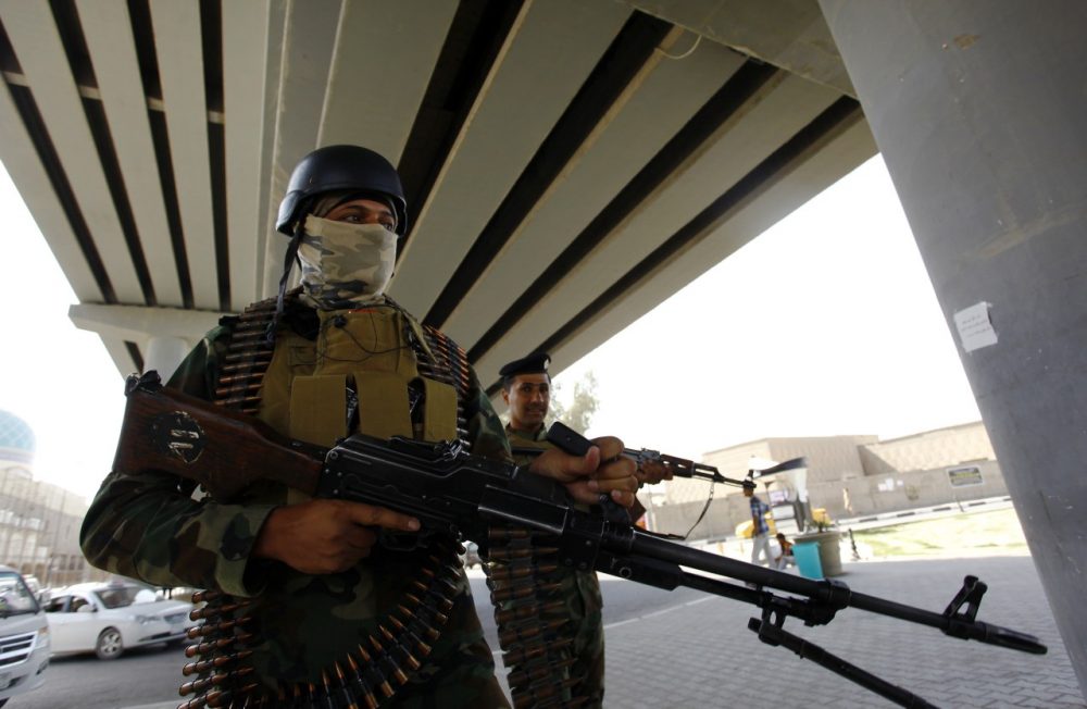 Iraqi security forces stand guard in the holy city of Najaf, on September 30, 2014. The holy Shiite city of Najaf has gained prominence as a centre of political and military power since the start of a crisis that has raised the spectre of Iraq breaking up along sectarian and ethnic lines. (Haidar Hamdan/AFP/Getty Images)