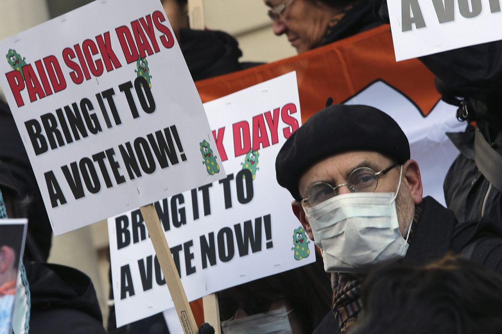  In this Friday, Jan. 18 2013 file photo, activists hold signs during a rally at New York's City Hall to call for immediate action on paid sick days legislation. Two months after a severe flu season forced millions of workers to stay home, paid sick time is becoming an issue for many small business owners. (AP)