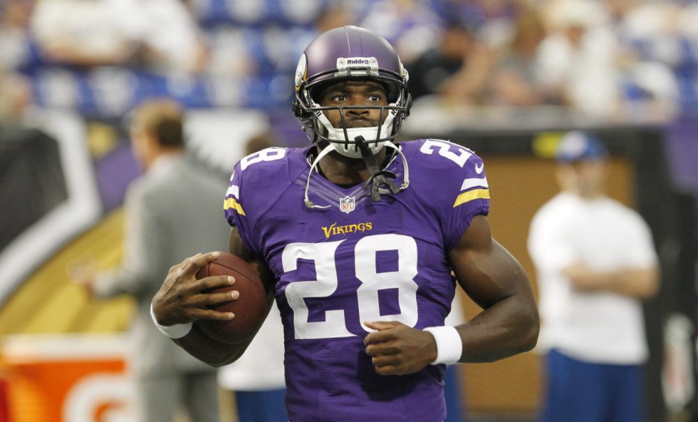 Minnesota Vikings running back Adrian Peterson warms up before an NFL preseason football game against the Tennessee Titans Thursday, Aug. 29, 2013, in Minneapolis. (AP)