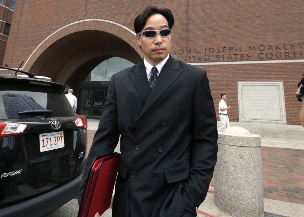 Glenn Adam Chin, former supervisory pharmacist at the New England Compounding Center, leaves federal court in Boston Thursday after pleading not guilty to charges stemming from a deadly meningitis outbreak linked to the Framingham compounding pharmacy. (Steven Senne/AP)