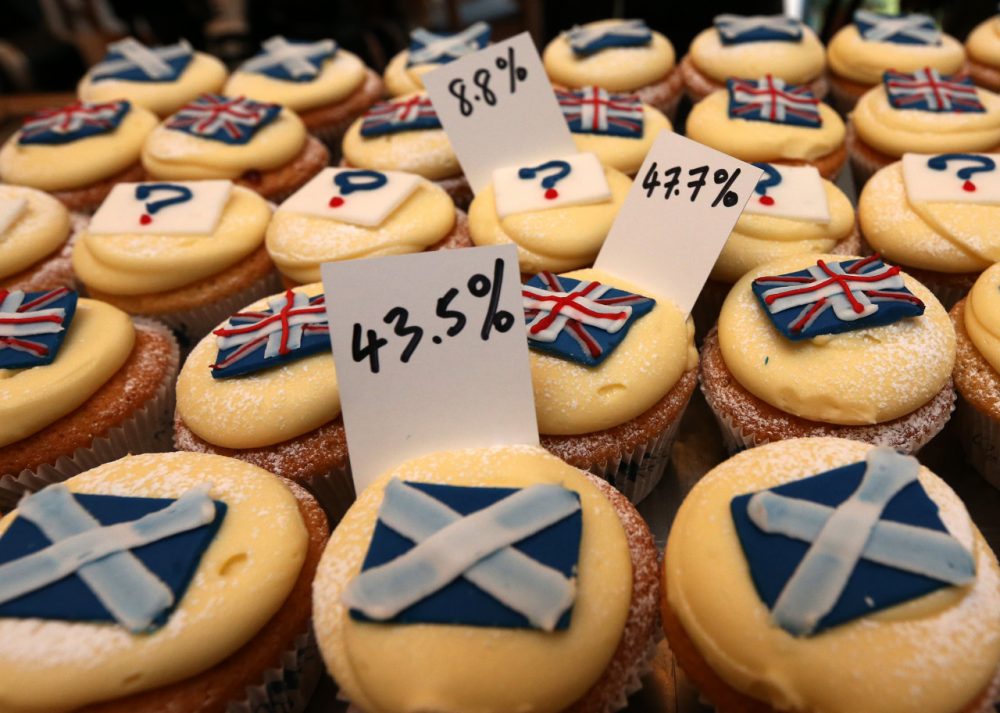 A view of cupcakes decorated with the Union and Scottish Saltire flags, and question marks, along with the results of sales, at Cuckoo's bakery, in Edinburgh, Scotland, Wednesday, Sept. 17, 2014. The bakery has been monitoring the sales of its Union and Saltire flag and undecided cupcakes for 200 days to try and predict the outcome of the referendum. 43.5 percent of sales were Yes cakes, 47.7 percent No, and 8.8 percent undecided. (AP)