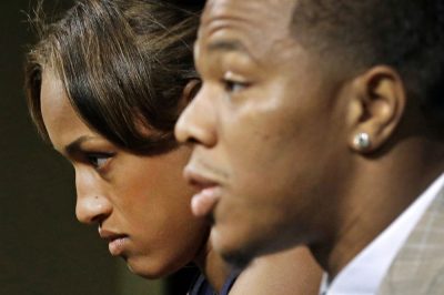 In this May 23, 2014, file photo, Janay Rice, left, looks on as her husband, Baltimore Ravens running back Ray Rice, speaks to the media during a news conference in Owings Mills, Md. (AP/Patrick Semansky)
