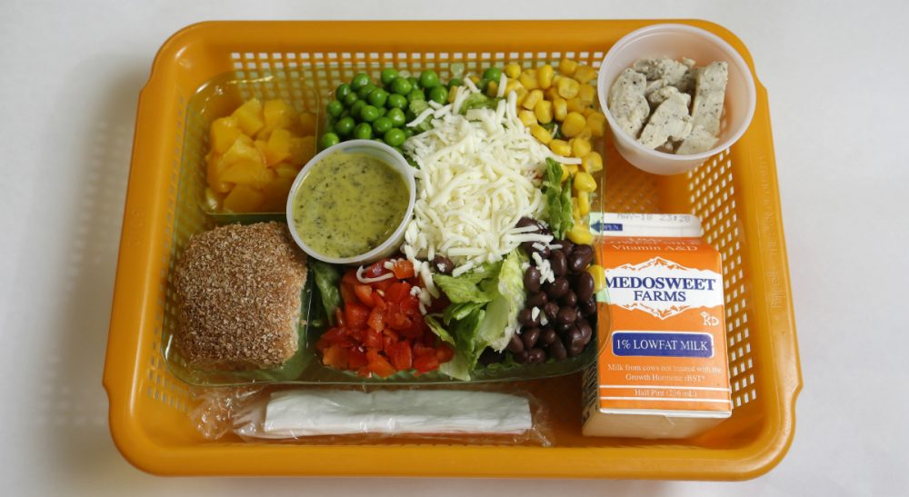 Ashley Stanley: &quot;Hunger doesn’t require expensive scientific analysis, vaccines or cures. It requires connecting existing resources to people that need it.&quot; Pictured: A school lunch salad entree option featuring low-sodium chicken, a whole-grain roll, fresh red peppers, and cilantro dressing is assembled in a lunch basket at Mirror Lake Elementary School in Federal Way, Wash., south of Seattle, Monday, May 5, 2014. (Ted S. Warren/AP)