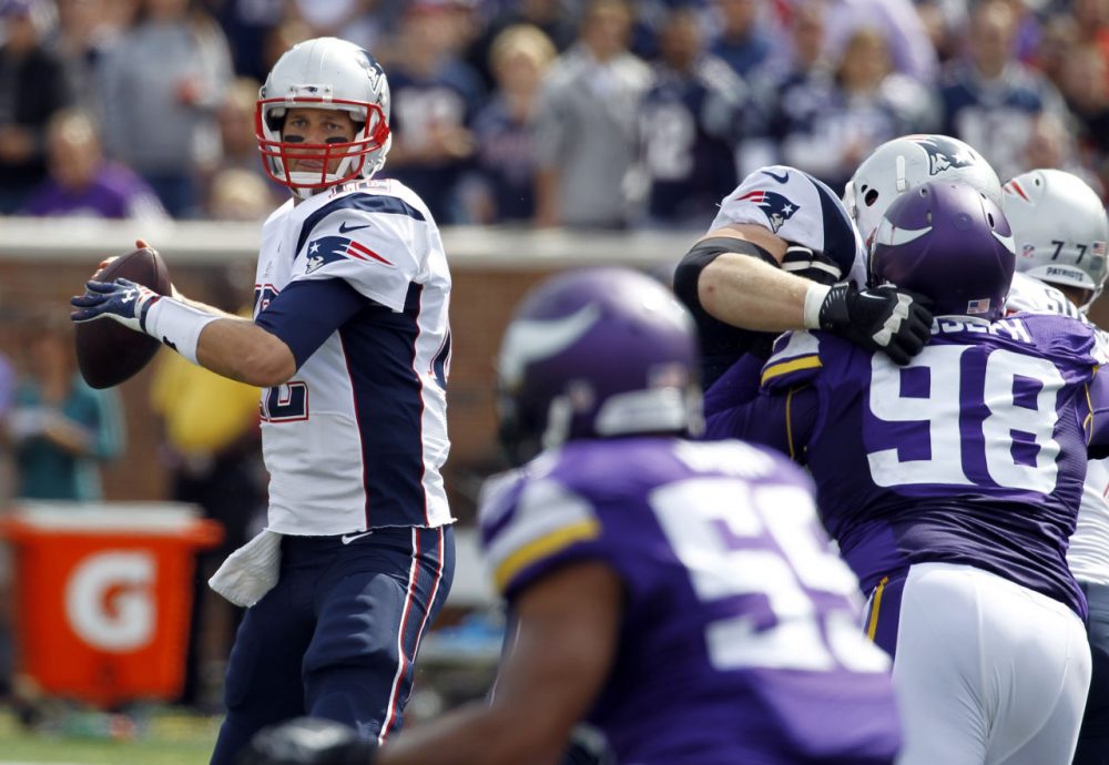 New England Patriots quarterback Tom Brady throws a pass during the second quarter of an NFL football game against the Minnesota Vikings Sunday. (Ann Heisenfelt/AP)