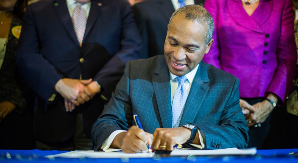 John Rosenthal: &quot;Gun violence claims 88 lives a day in this country, including that of one child every three hours. While there are no fail safes, few states have been more proactive in trying to establish them.&quot; Pictured: Governor Deval Patrick signs H. 4376, An Act Relative to the Reduction of Gun Violence, into law on August 13, 2014. (massgovernor/Flickr)
