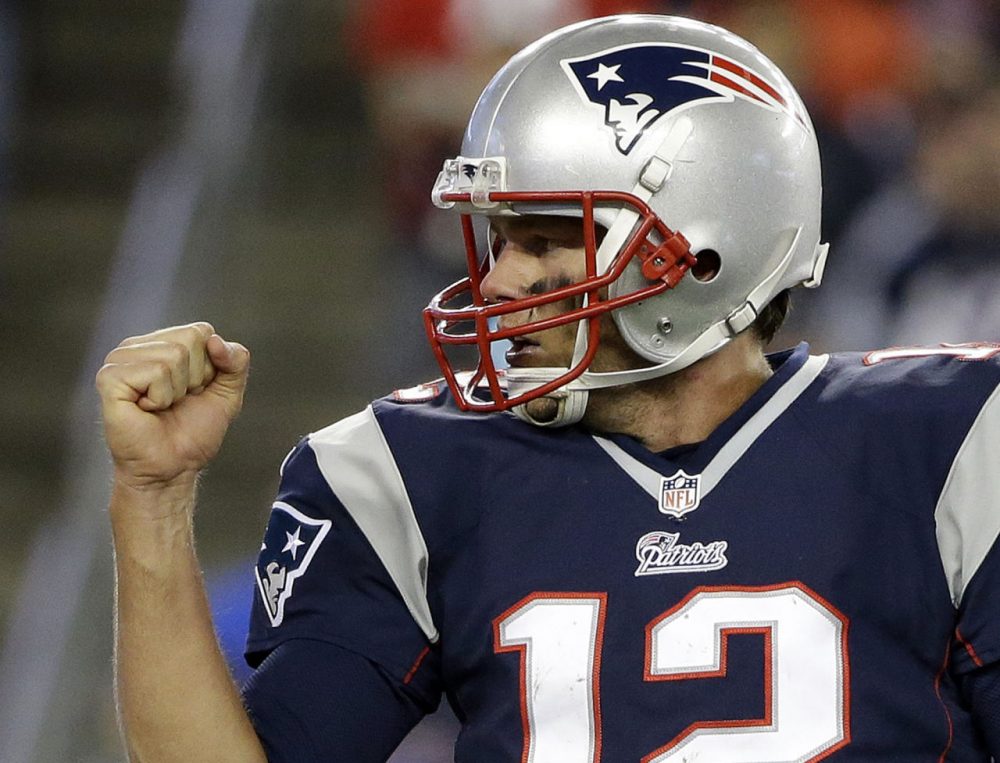 New England Patriots quarterback Tom Brady, right, celebrates a