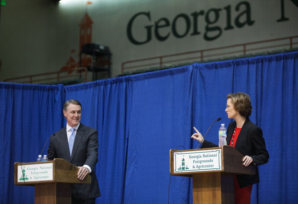 Georgia Democratic candidate for U.S. Senate Michelle Nunn, right, speaks as Republican candidate David Perdue looks on during a debate, Tuesday, Oct. 7, 2014, in Perry, Ga. (David Goldman/AP)