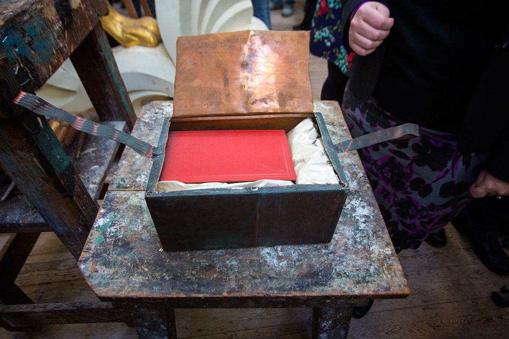 Inside the time capsule you could see a red book, which was not among the items cataloged in earlier news reports about the capsule. (Jesse Costa/WBUR)