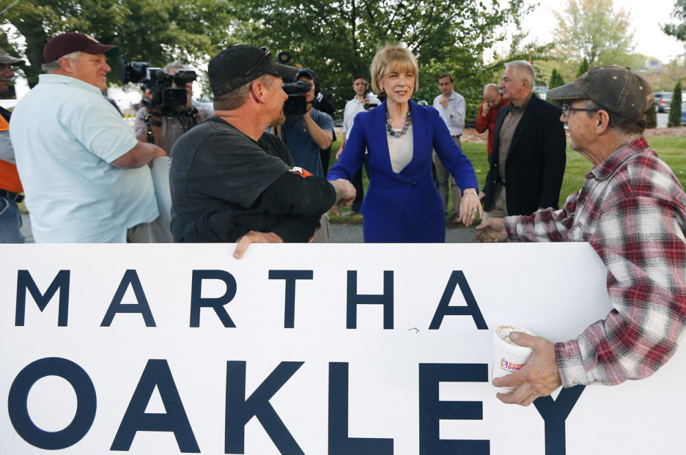 Martha Coakley greets supporters as she arrives at the WBZ studios in Boston for a debate Tuesday. (Elise Amendola/AP)