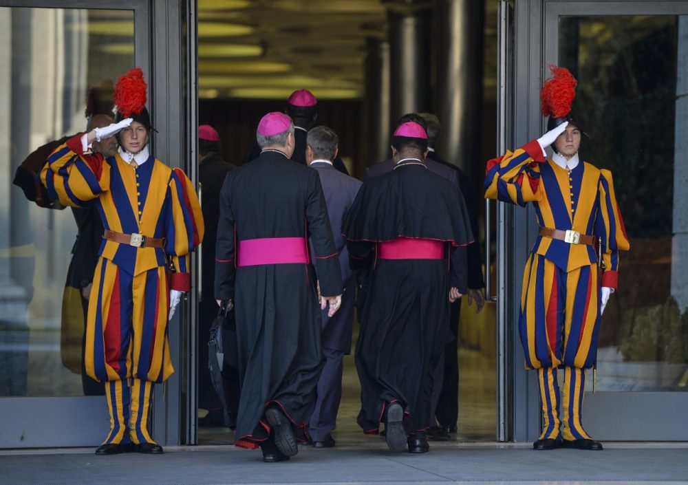 Bishops arrive at the Synod on the Families, in the Synod Aula, at the Vatican, on October 6, 2014. The Pontiff on Sunday launched a major review of Catholic teaching on the family that could lead to change in the Church's attitude to marriage, cohabitation and divorce. (Andreas Solaro/AFP/Getty Images)