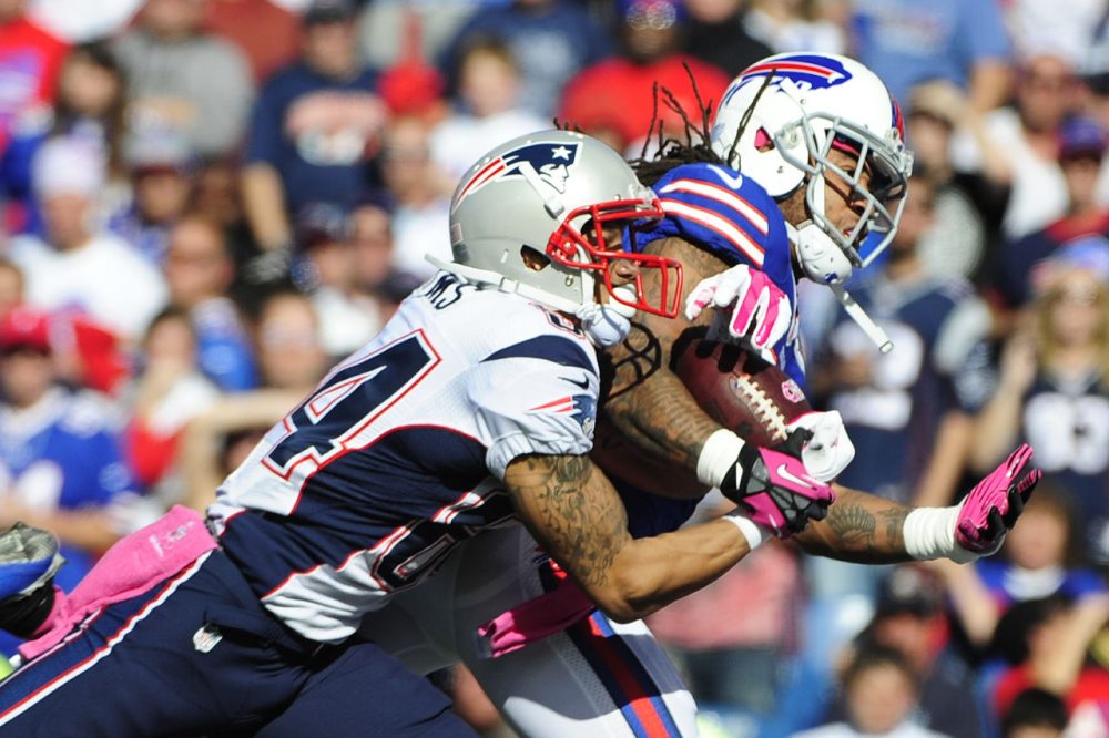 New England Patriots wide receiver Brian Tyms (84) catches a pass for a touchdown as he is defended by Buffalo Bills' Stephon Gilmore (24).(Gary Wiepert/AP)