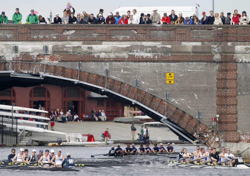 A crowd gathered on a bridge to watch the 2016 Head of the Charles Regatta. (Michael Dwyer/AP)