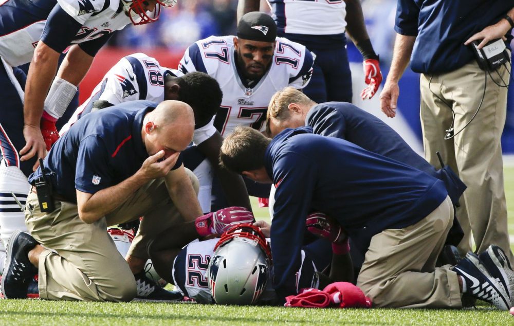 Trainers assist Stevan Ridley (22) after he was injured on a play in the second half of the Patriots' game against the Buffalo Bills. (Mike Groll/AP)