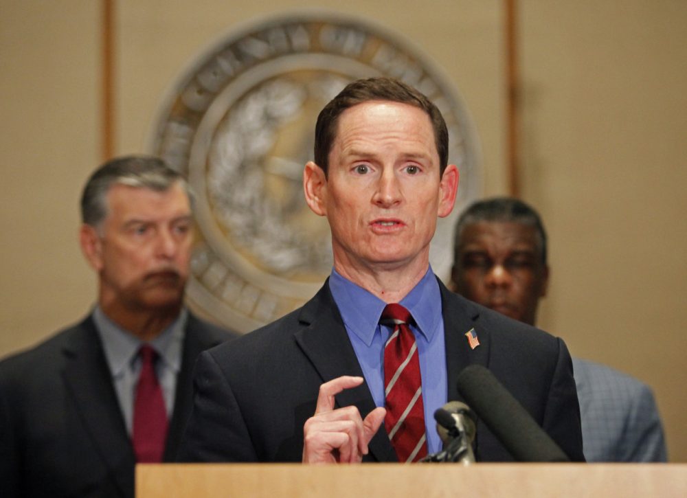 Dallas County Judge Clay Jenkins answers questions at the podium during a press conference held at the Dallas County Commissioners Court concerning the second health care worker to contract Ebola. (Stewart F. House/Getty Images)