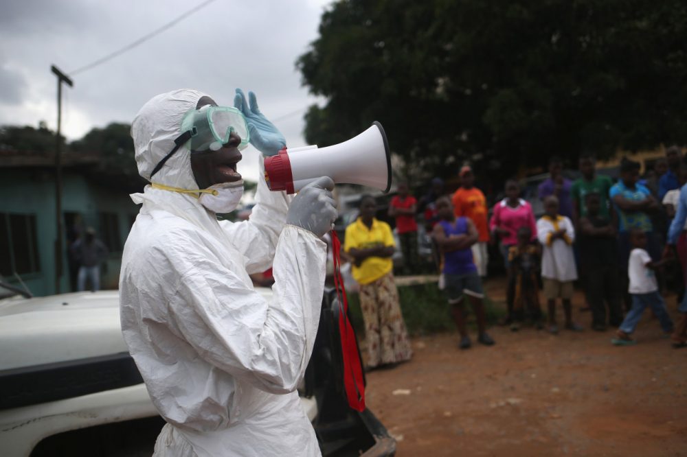 Aid workers from the Liberian Medical Renaissance League stage an Ebola awareness event on October 15, 2014 in Monrovia, Liberia.(John Moore/Getty Images)