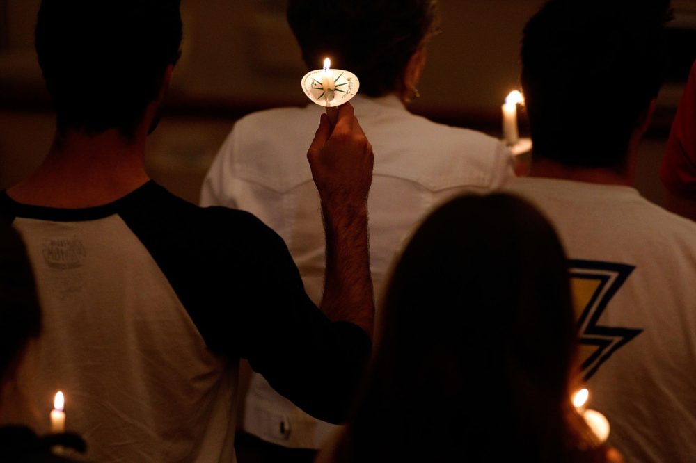 Attendees hold candles at a prayer vigil on the campus of TCU for health care worker Nina Pham who was diagnosed with the Ebola virus on October 14, 2014 in Dallas, Texas. (Mike Stone/Getty Images)