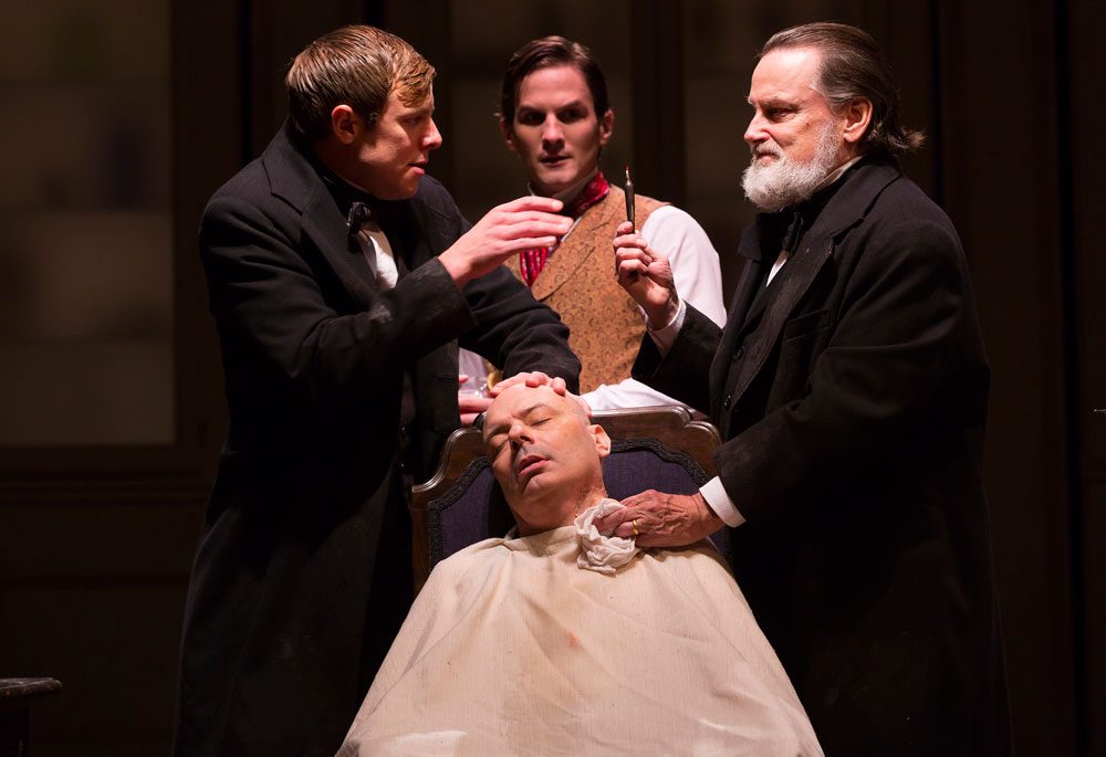 Greg Balla, Lee Sellars (seated), Tom Patterson and Richmond Hoxie act in a scene from &quot;Ether Dome.&quot; (Courtesy T. Charles Erickson/Huntington Theatre)