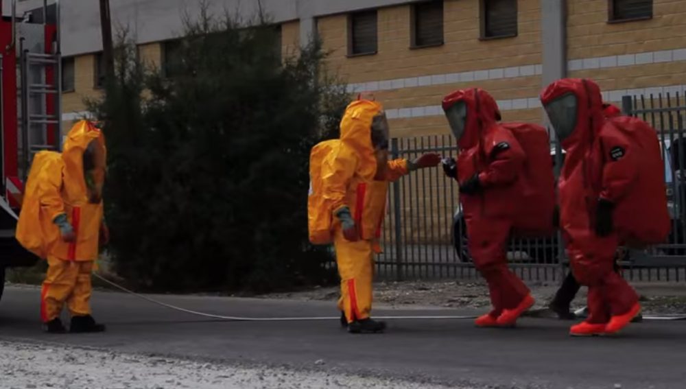 Ebola has ratcheted up the tenor of political ads ahead of the midterms. This ad, paid for by the Agenda Project Action Fund, splices imagery of hazmat crews with sound bites of Republicans cutting funding to public health organizations. (Screenshot from Agenda Project Action Fund ad)