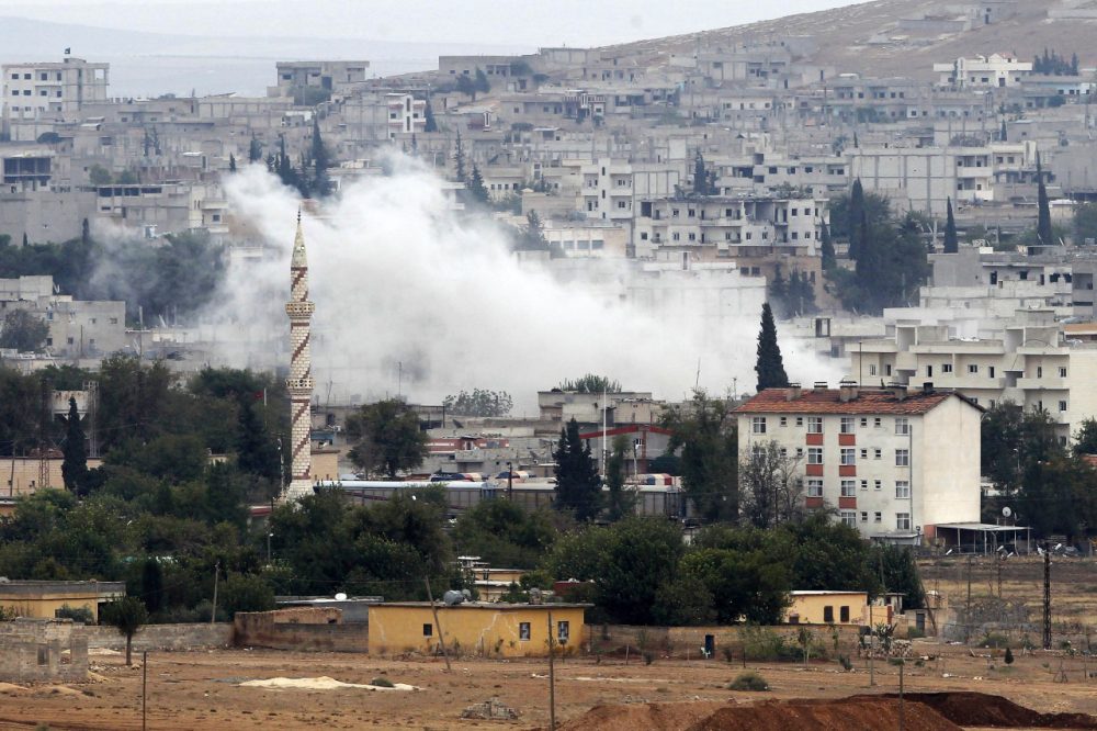 Smoke rises from the Syrian town of Kobani, on October 17, 2014. Islamic State militants have suffered setbacks and have begun retreating from parts of the beseiged Syrian border town according to a local official. (Gokhan Sahin/Getty Images)
