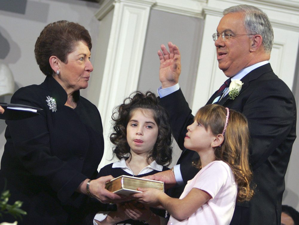 Menino with his wife, Angela, and granddaughters Giulia Fenton, center, and Samantha Menino during his swearing-in on Jan. 2, 2006. (Michael Dwyer/AP)