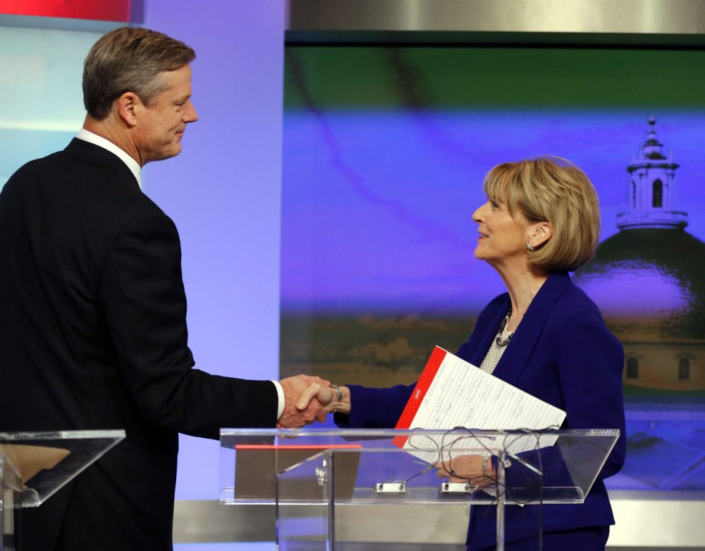 Massachusetts gubernatorial candidates, Republican Charlie Baker and Democrat Martha Coakley, shake hands before a debate. (Elise Amendola/AP)