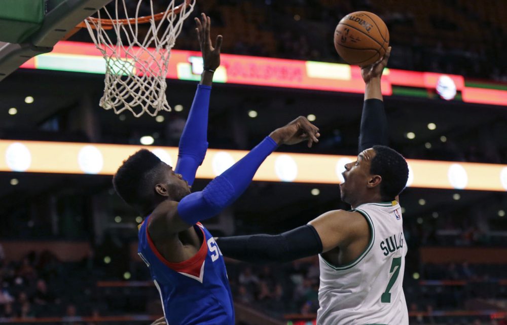 Boston Celtics center Jared Sullinger (7) shoots over Philadelphia 76ers forward Nerlens Noel during the first quarter of a preseason game in Boston on Monday. (Charles Krupa/AP)