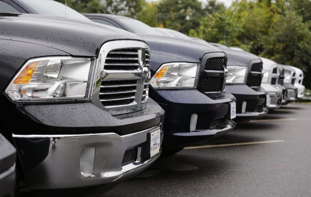 Dodge Ram pickup trucks are lined up for sale at Bill DeLuca's dealerships in Haverhill, Mass., Wednesday, Oct. 1, 2014. Chrysler Group says its U.S. sales rose 19 percent in September thanks to strong demand for the new Jeep Cherokee SUV and the Ram pickup. (Charles Krupa/AP)