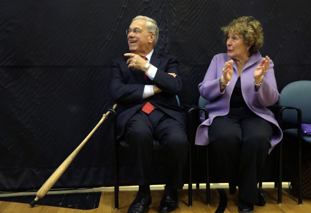 Former Boston Mayor Thomas Menino’s imprint is all over Hyde Park, where he grew up and raised his family. Pictured here, Menino's wife Angela applauds as he is introduced at a 2013 ceremony held to name the Hyde Park YMCA after him. (AP)