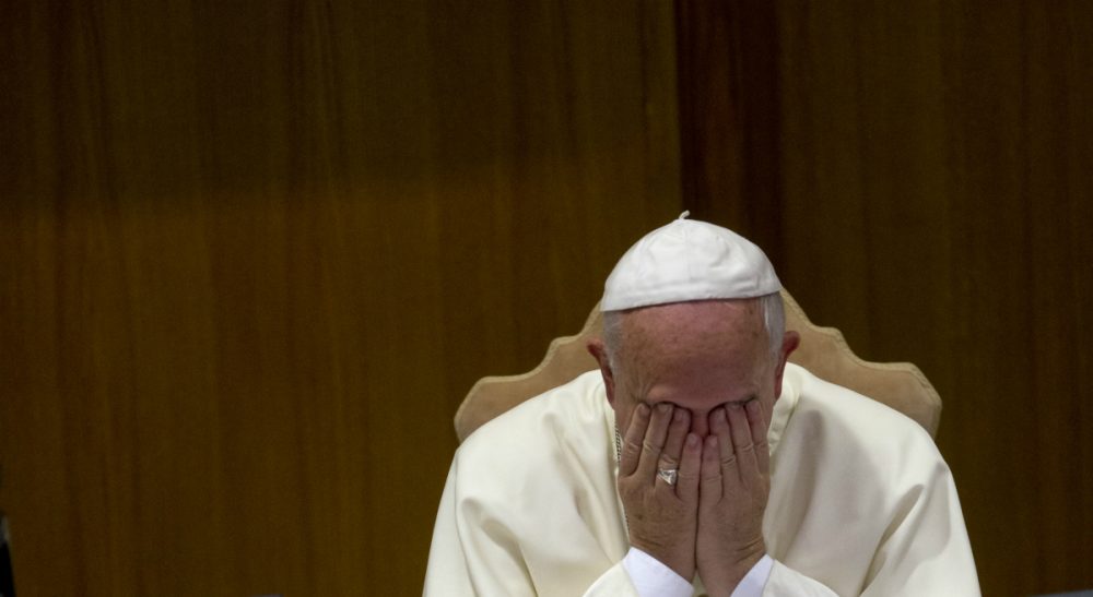 Eileen McNamara: &quot;By what measure of rational thought is a draft document that asks about homosexuals -- and only asks -- whether the Catholic Church is 'capable of welcoming these people' a cause for celebration?&quot; Pictured: Pope Francis rubs his face during a morning session of a two-week synod on family issues, at the Vatican, Friday, Oct. 10, 2014. Gay rights groups are cautiously cheering a shift in tone from the Catholic Church toward homosexuals. (Alessandra Tarantino/AP)