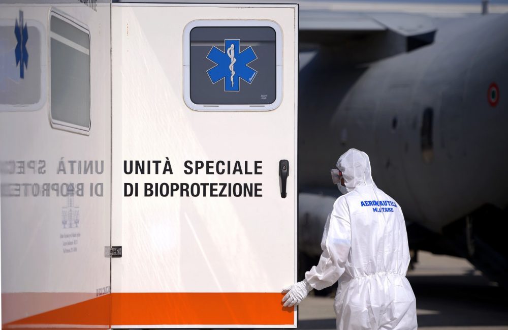 An Italian military personnel wearing a protective gets ready to take care of a pretended Ebola victim during a specialized training course for the management and transport of highly contagious patients, in Rome's Pratica di Mare military airport in Pomezia on September 24, 2014. (Filippo Monteforte/AFP/Getty Images)