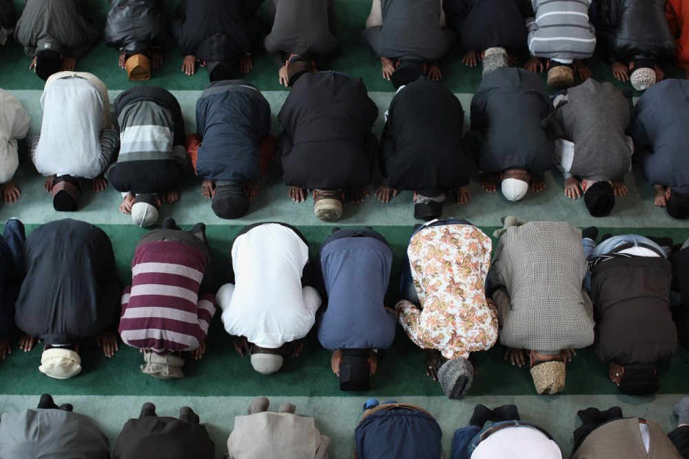  Muslim men pray after a speach by the Islamic Khalifa of the Ahmadiyya Muslim community Mirza Masroor Ahmad at Baitul Futuh Mosque in Morden on September 21, 2012 in London, England.  (Photo by Dan Kitwood/Getty Images)