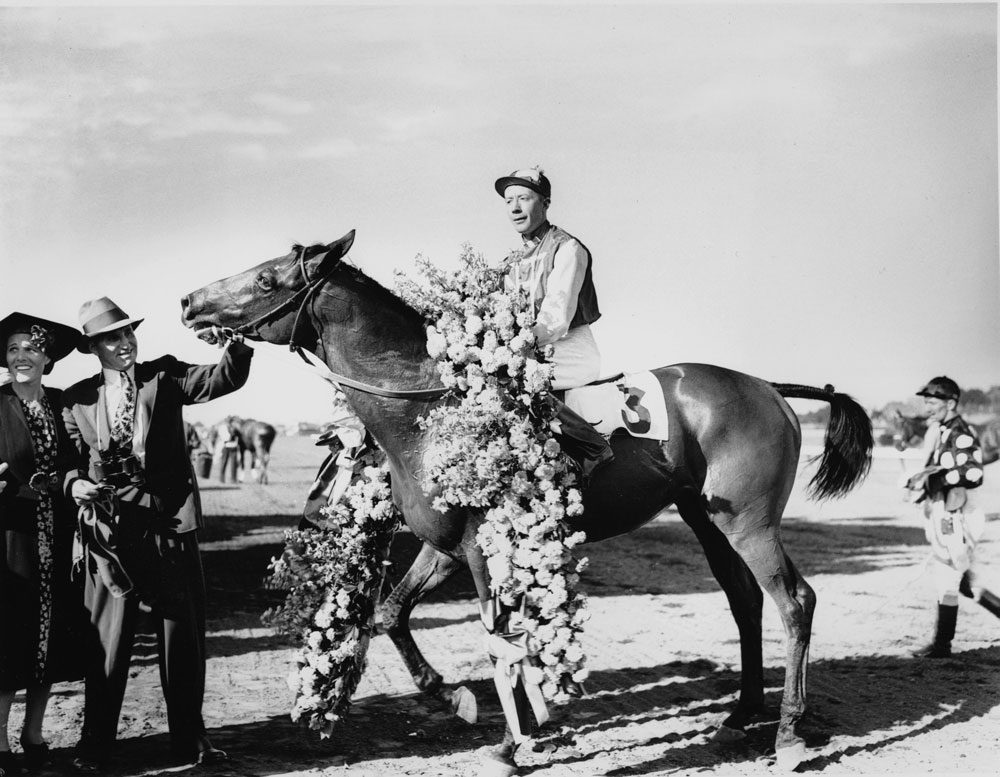Seabiscuit is shown with jockey Johnny &quot;Red&quot; Pollard after winning the Massachusetts Handicap at Suffolk Downs on Aug. 7, 1937. (AP)