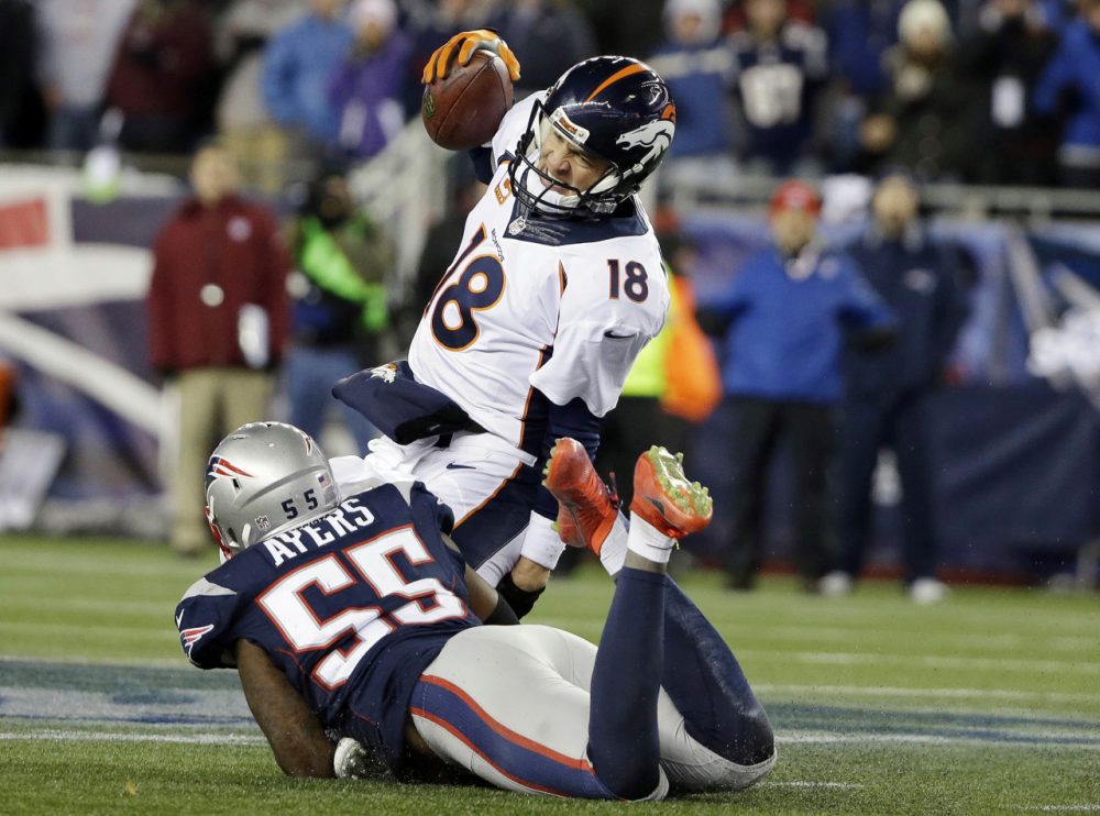 Patriots linebacker Akeem Ayers sacks Broncos quarterback Peyton Manning. Manning threw two touchdowns and two interceptions in the 43-21 Patriots win. (Steven Senne/AP)