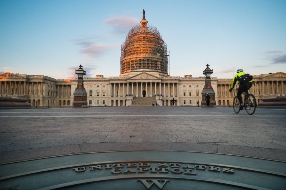 A cyclist rides across the front plaza of the U.S. Capitol on Nov. 4, 2014 in Washington.  (J. David Ake/AP)