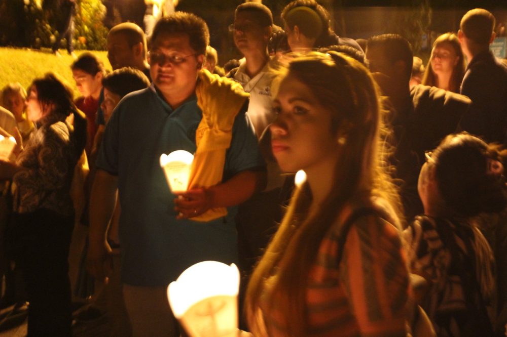 Thousands joined the candlelit procession, traveling throughout the campus of the University of Central America to commemorate the 25th anniversary of the murder of six Jesuit priests, their housekeeper and daughter. (Shannon Dooling / WBUR)