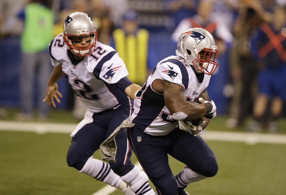 Jonas Gray (right) rushed for a career-high 199 yards and a franchise-record four touchdowns to lead the Patriots to a 42-20 victory over the Colts. (Darron Cummings/AP)