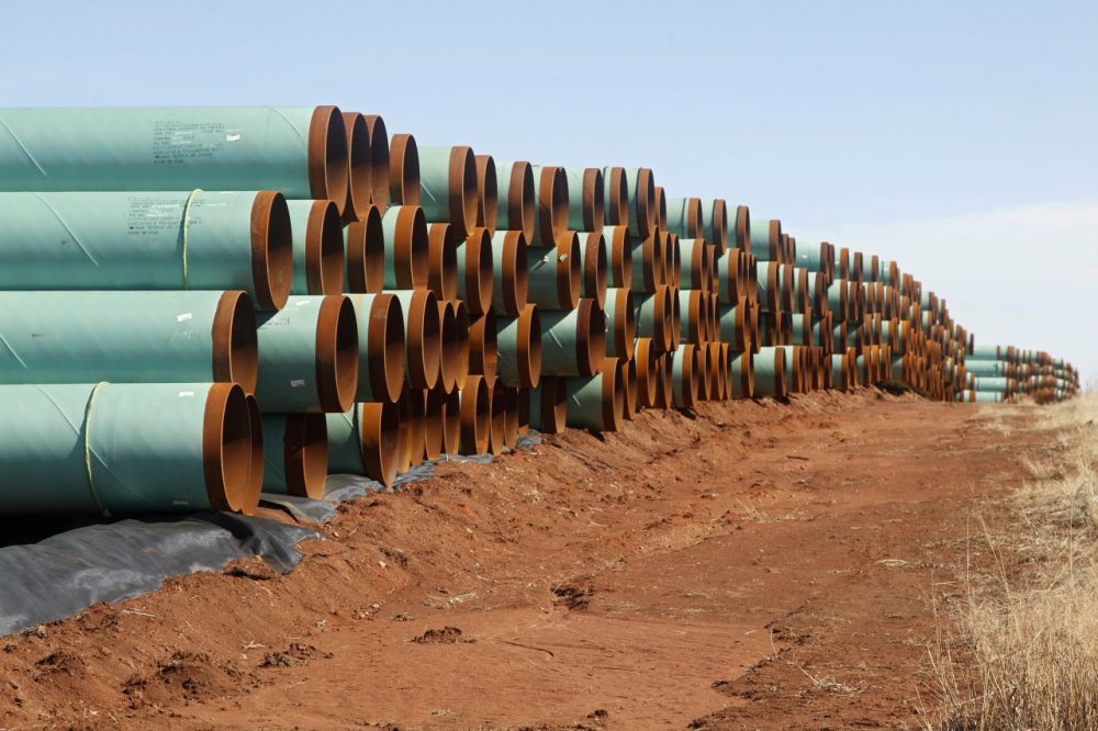 Miles of pipe ready to become part of the Keystone Pipeline are stacked in a field near Cushing, Okla. in 2012. (Sue Ogrocki/AP)