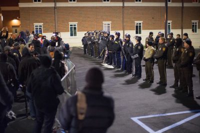 Police face demonstrators protesting the shooting death of 18-year-old Michael Brown outside the police station on November 20, 2014 in Ferguson, Missouri. At least three people were arrested during the protest. Brown was killed by Darren Wilson, a Ferguson police officer, on August 9. A grand jury is expected to decide this month if Wilson should be charged in the shooting.  (Scott Olson/Getty Images)
