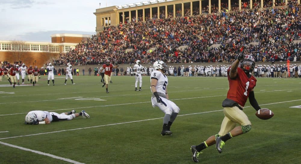 Peter May: The Ivy League allows its team to compete for NCAA titles in virtually every competitive sport – except football. In this photo, Harvard wide receiver Andrew Fischer (1) runs into the end zone for a late fourth quarter touchdown against Yale in their NCAA college football game at Harvard Stadium Saturday, Nov. 22, 2014 in Cambridge, Mass. (Stephan Savoia/AP)