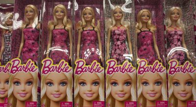 Mattel gets it wrong -- again -- with a &quot;computer engineer&quot; Barbie who can't code and needs help from boys. To say nothing of that hot pink laptop. (Ariana Cubillos/AP)
