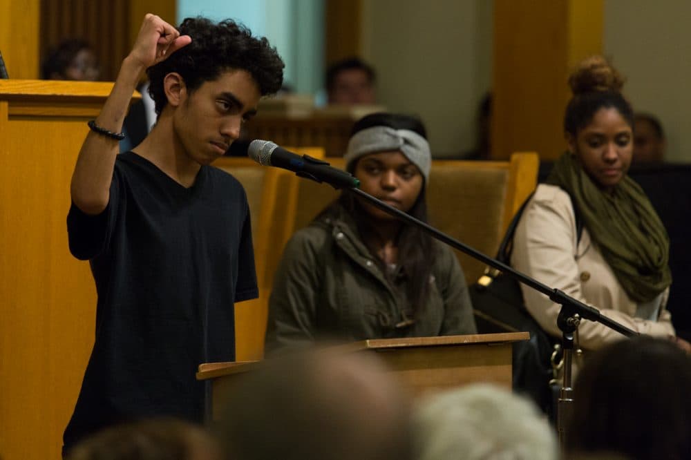 A young protester addresses delivers his thoughts on Ferguson at a packed meeting in a Roxbury church. (Joe Spurr/WBUR)