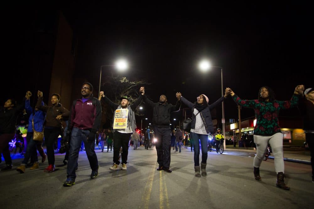 In Boston, hundreds of protesters marched through the city streets in solidarity with demonstrators in Ferguson in the aftermath of a grand jury&#8217;s decision to not indict a white officer who shot and killed an unarmed black teen. 