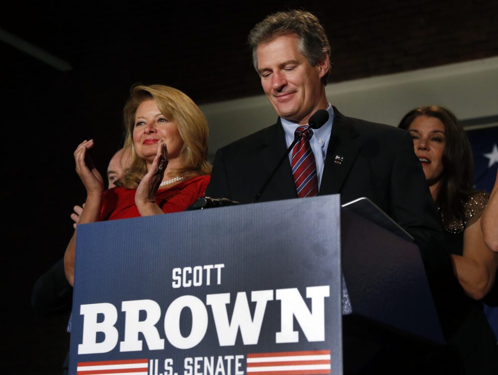 New Hampshire Republican Senate candidate Scott Brown, with his wife Gail Huff, left, concedes defeat to incumbent U.S. Sen. Jeanne Shaheen at his election night party in Manchester, N.H., on Nov. 4. (Elise Amendola/AP)