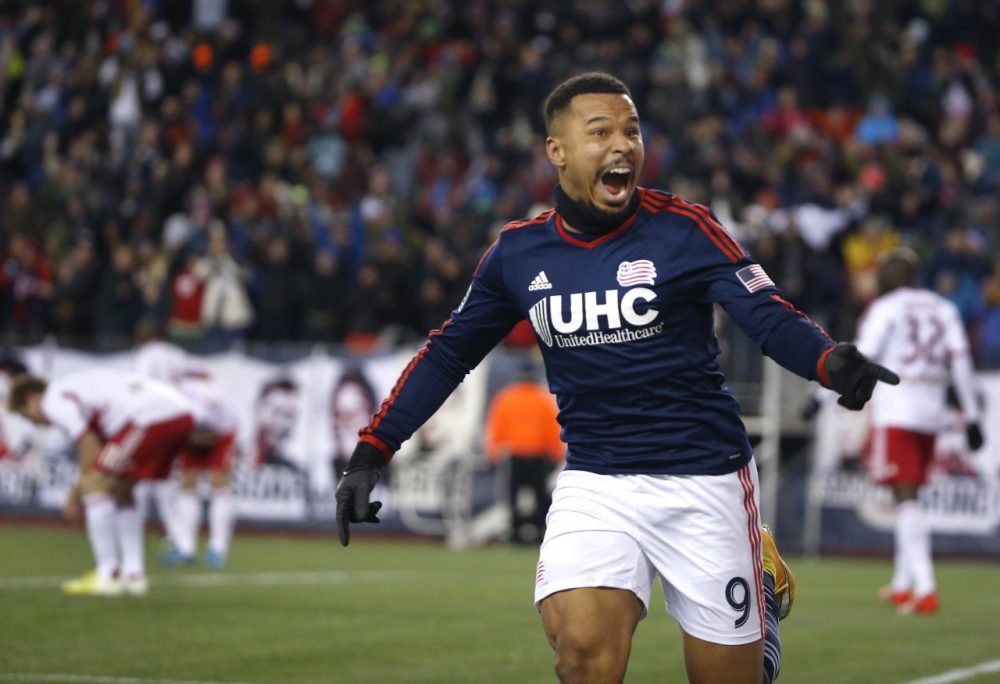 The Revolution's Charlie Davies celebrates his goal against the Red Bulls during the second half of the second soccer game of the MLS Eastern Conference final in Foxborough Saturday. The match ended 2-2 and New England advances to the MLS Cup with a two-game aggregate 4-3. (Elise Amendola/AP)