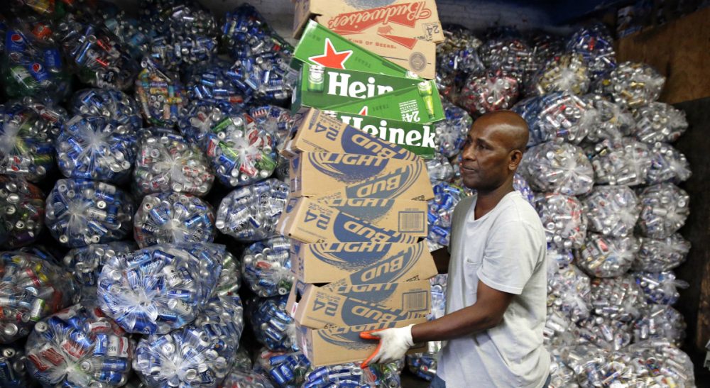 Jimmy Tingle: &quot;I’m supporting the expanded Bottle Bill to include plastic water bottles and sports drinks, because it’s good for the environment, saves energy and puts money back into the pockets of consumers.&quot; Pictured: Sorting bottles and cans at a redemption center in the East Boston, Tuesday, Sept. 30, 2014. If approved on Nov. 4, a ballot measure would expand the state's law by adding 5-cent deposits to most non-alcoholic and non-carbonated beverage containers. (Michael Dwyer/ AP)