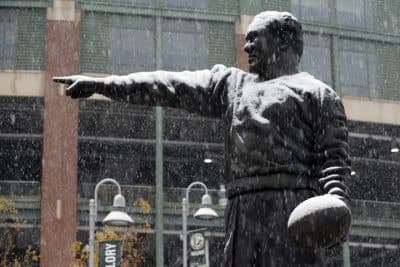 Snow falls on the Curly Lambeau statue at Lambeau Field, Monday, Nov. 10, 2014, in Green Bay, Wis. A frigid blast of air is moving into the mainland U.S. thanks to a powerful storm that hit Alaska with hurricane-force winds over the weekend. (AP)