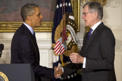 In this May 1, 2013 file photo, President Barack Obama shakes hands with then nominee for Federal Communications Commission, Tom Wheeler, in the State Dining Room of the White House in Washington. (AP)