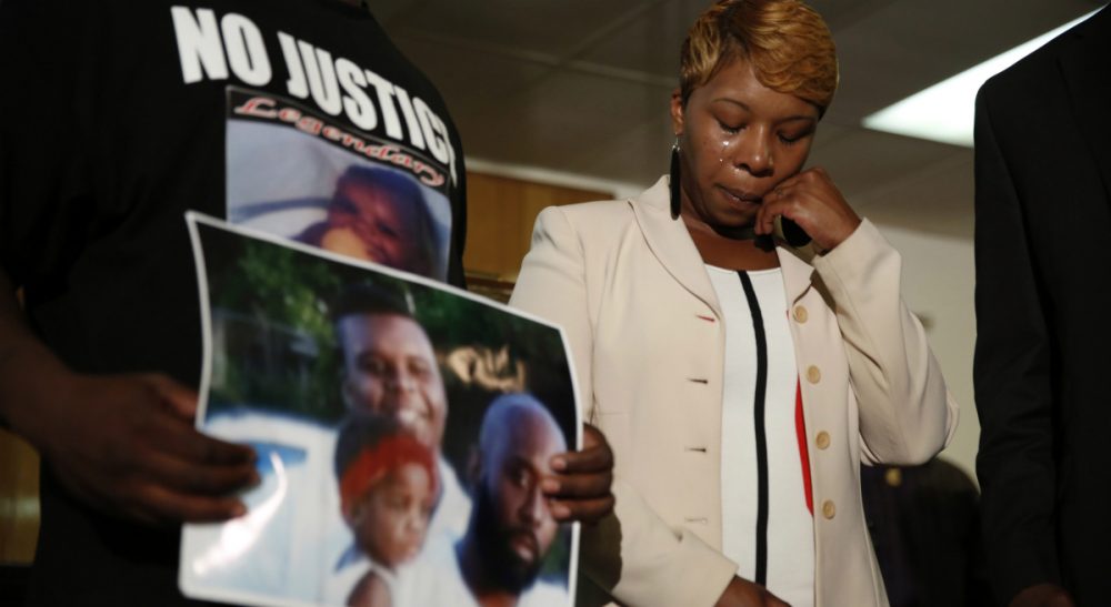 Steve Almond: It's time to convert our collective indignation and anguish into genuine moral progress. In this Aug. 11, 2014 file photo, Lesley McSpadden, the mother of 18-year-old Michael Brown, wipes away tears as Brown's father, Michael Brown Sr., holds up a family picture during a news conference in Jennings, Mo. (Jeff Roberson/AP)