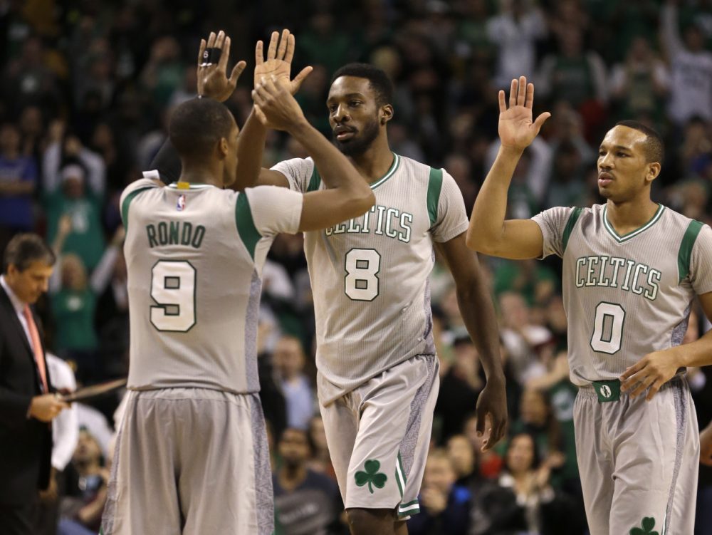 Boston Celtics guard Rajon Rondo (9) celebrates with forward Jeff Green (8) and guard Avery Bradley (0). (Steven Senne/AP)