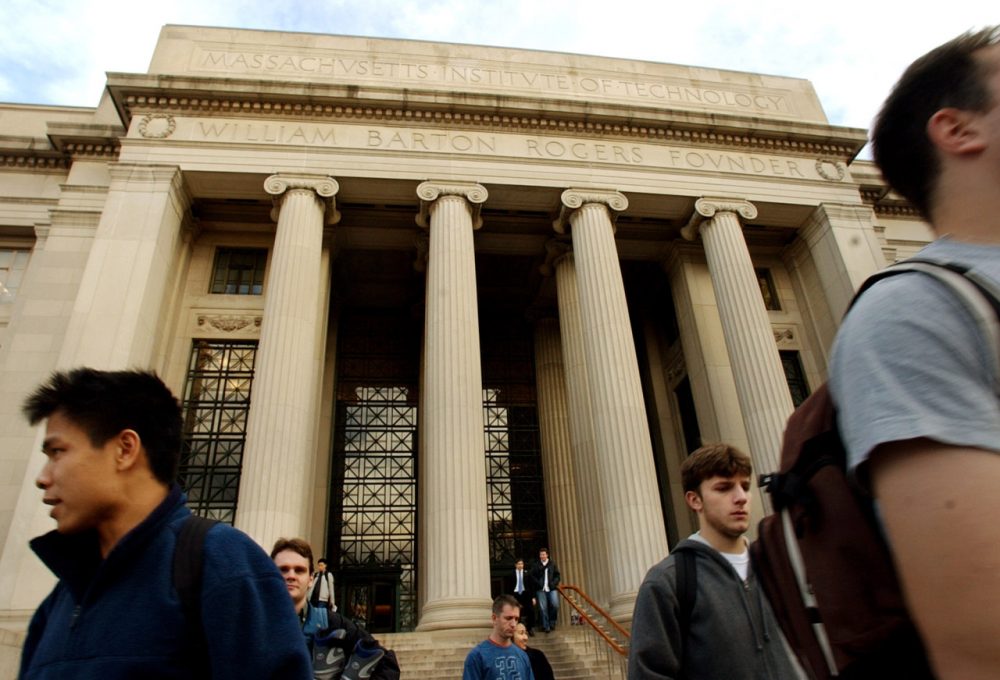 People exit a main entrance of the Massachusetts Institute of Technology, in Cambridge, Mass. (Steven Senne/AP)